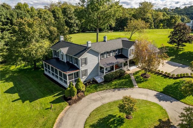 an aerial view of a house with outdoor space swimming pool and lake view