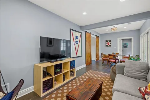 a spacious bedroom with a bed and lamp