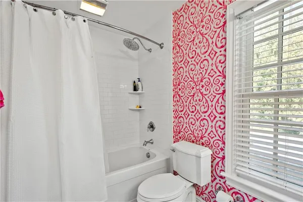 a bedroom with a bed and a fireplace