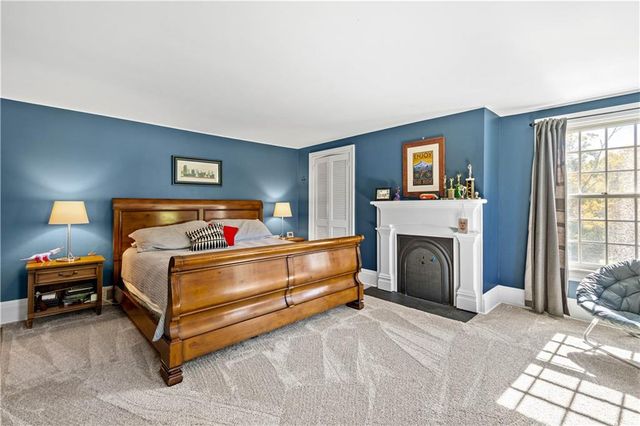 a view of a hallway with furniture
