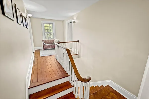 a bedroom with a bed and a chair