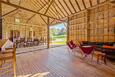a view of a chairs and table on the wooden floor