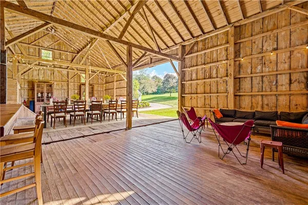 a view of a chairs and table on the wooden floor