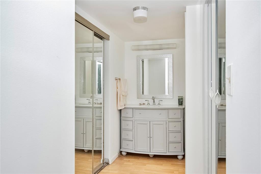 8150 West McNab Road, Unit 312 Tamarac, FL 33321 - Photo 12 of 32 a bathroom with a granite countertop sink and a mirror