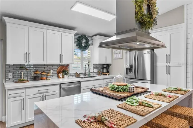 a kitchen with a stove a refrigerator and a stove