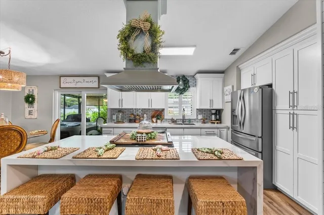 a bedroom with a bed couch and window
