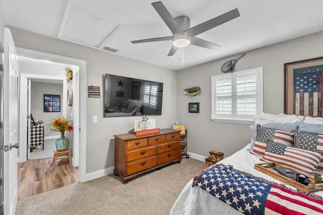 a bedroom with a bed and a desk