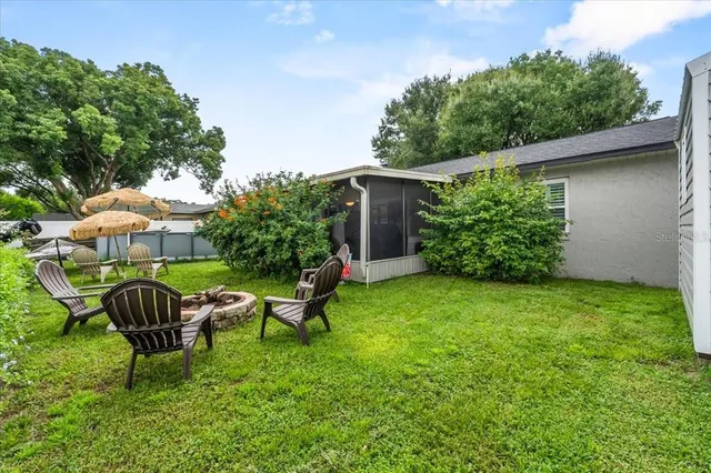 a view of a backyard with potted plants
