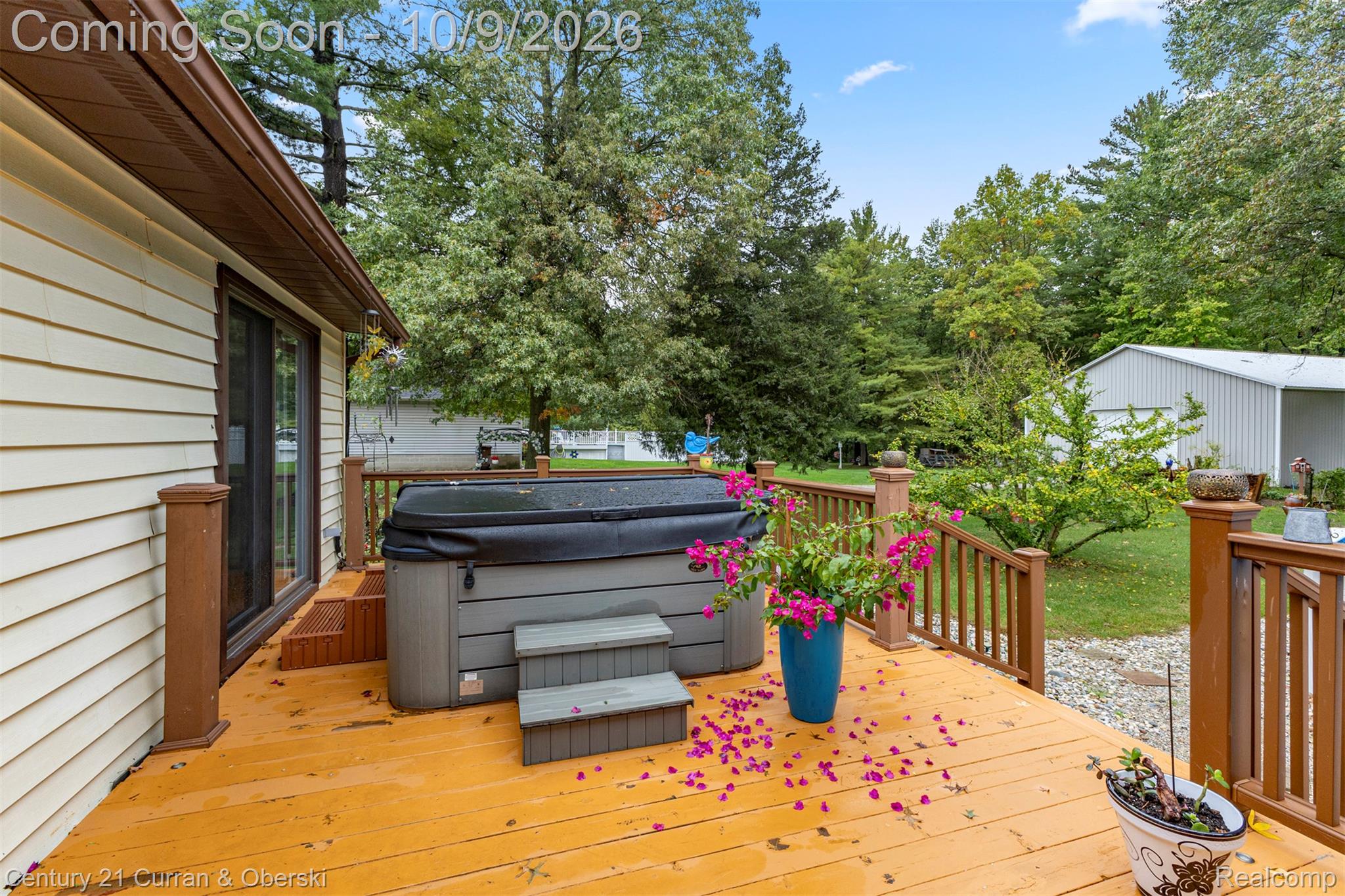 43040 Willis Road Belleville, MI 48111 - Photo 50 of 65 Expansive outdoor deck with a built-in hot tub and sliding glass door access