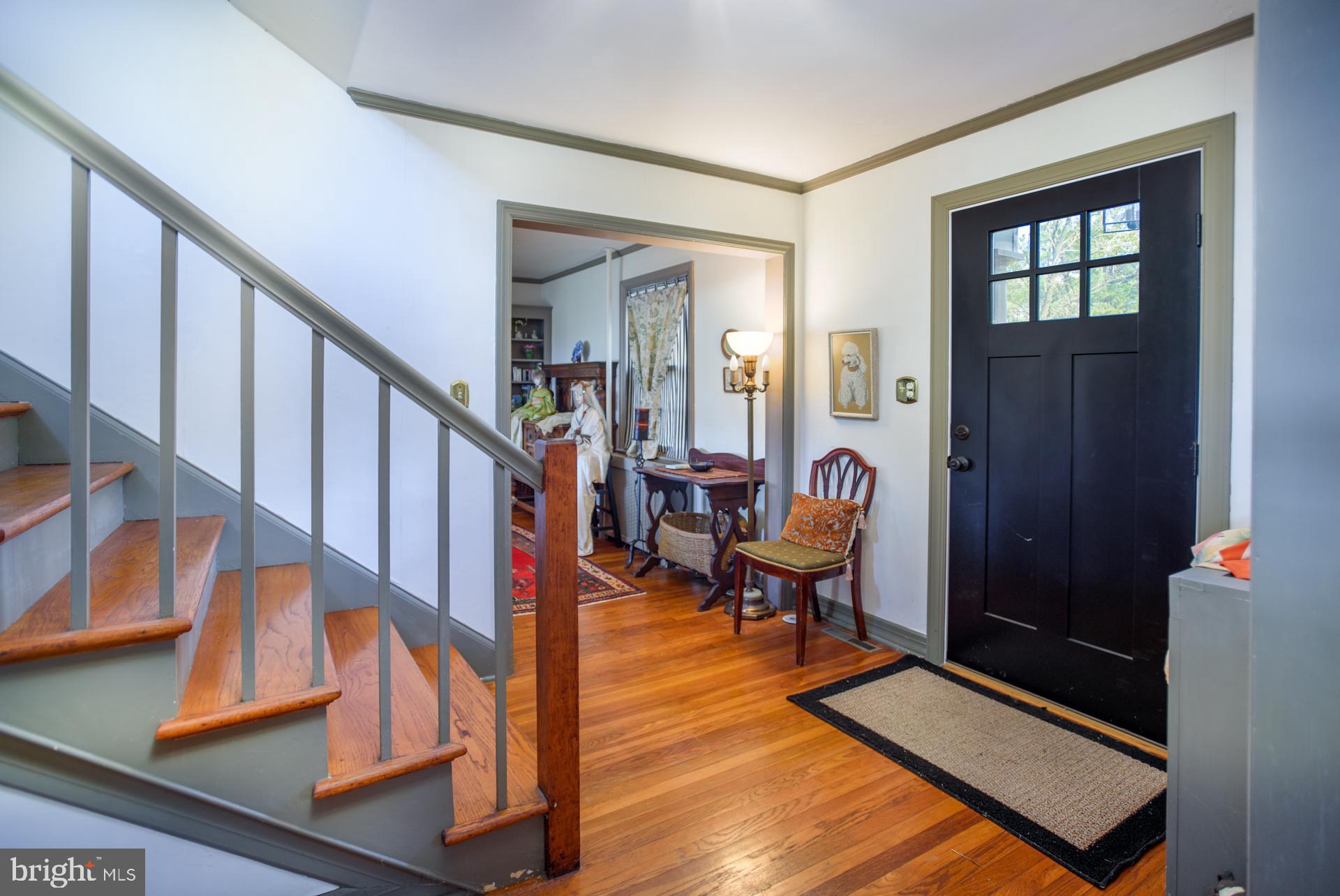 1308 Town Point Road Cambridge, MD 21613 - Photo 13 of 61 a view of an entryway with wooden floor and stairs