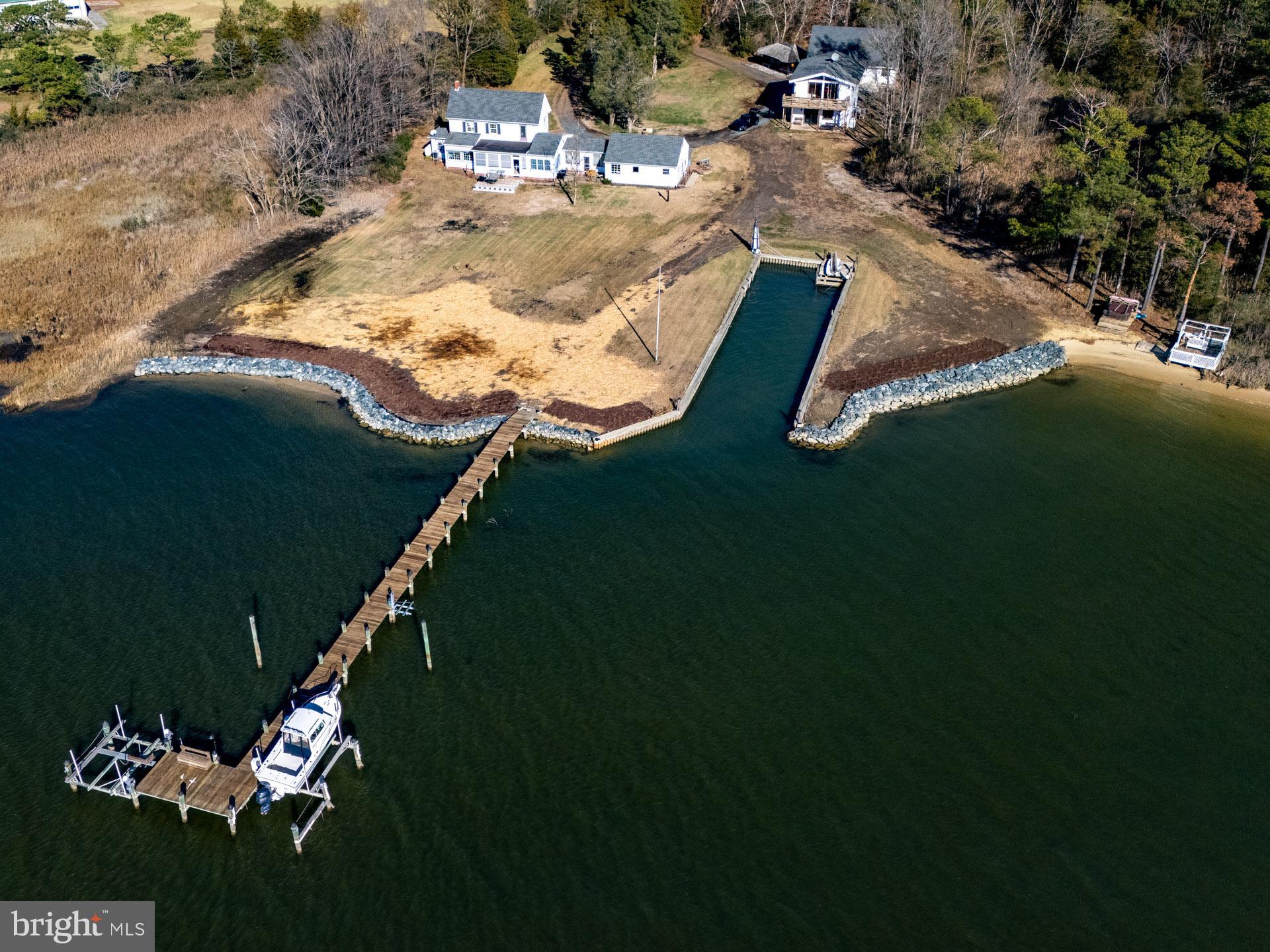 1308 Town Point Road Cambridge, MD 21613 - Photo 2 of 61 an aerial view of a house with a yard basket ball court and outdoor seating