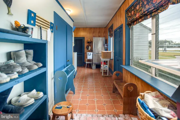 a bathroom with a sink a bathtub and a window