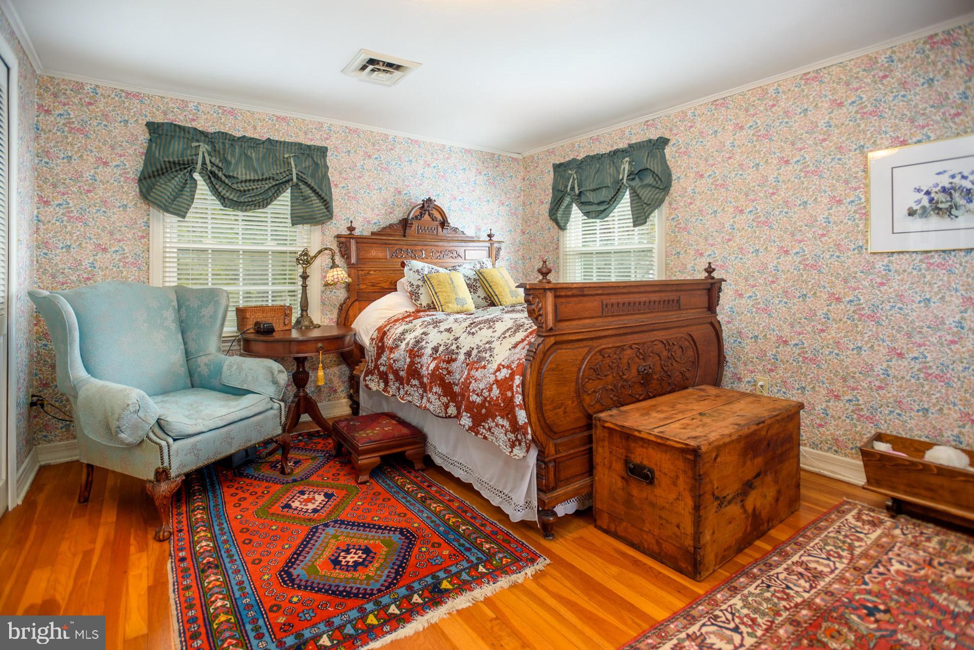1308 Town Point Road Cambridge, MD 21613 - Photo 27 of 61 a bedroom with two beds and painting on the wall