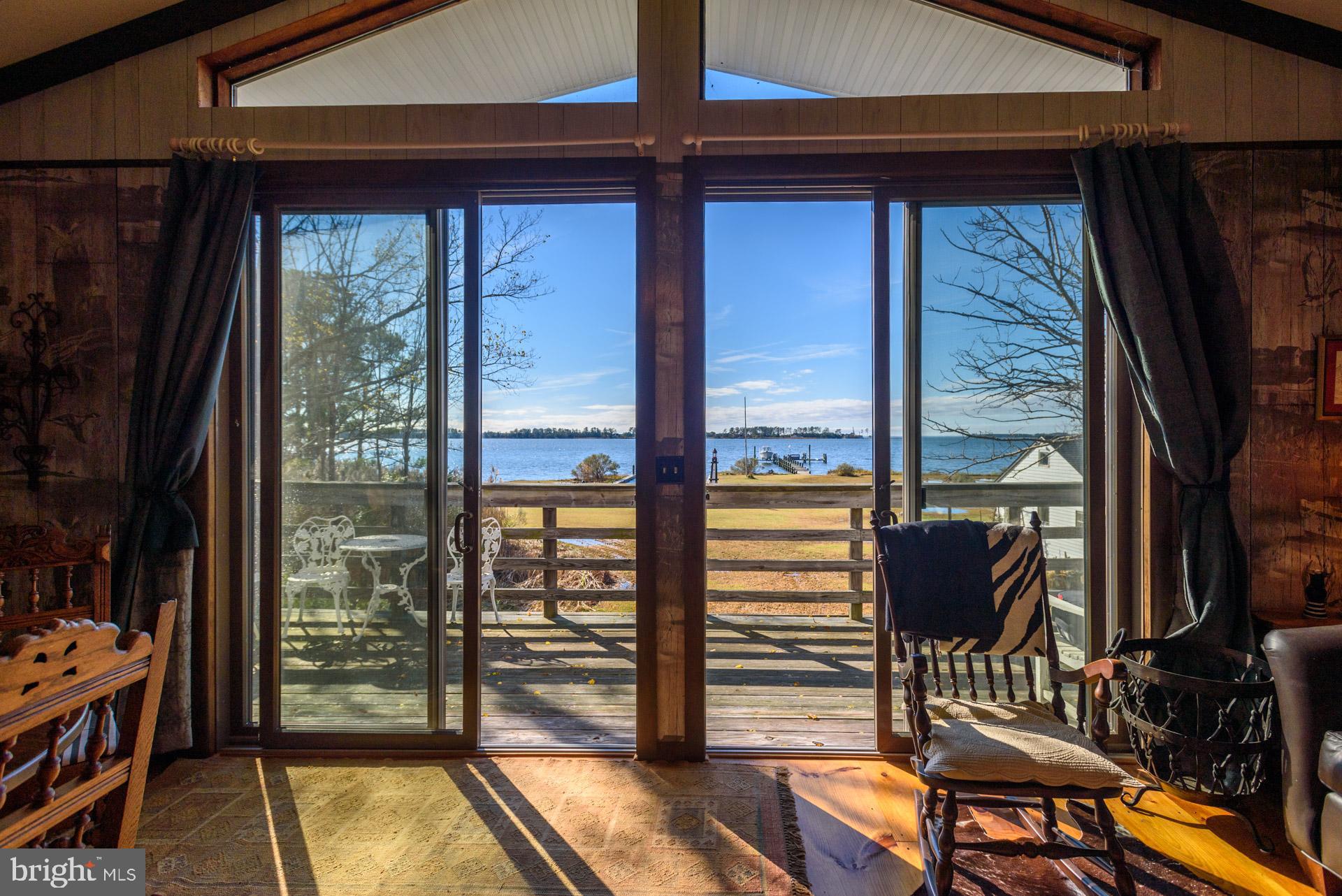 1308 Town Point Road Cambridge, MD 21613 - Photo 39 of 61 a view of a balcony dining area with furniture