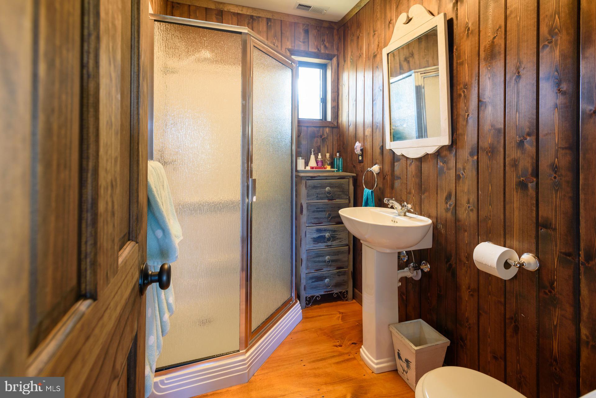 1308 Town Point Road Cambridge, MD 21613 - Photo 42 of 61 a bathroom with a sink toilet and shower