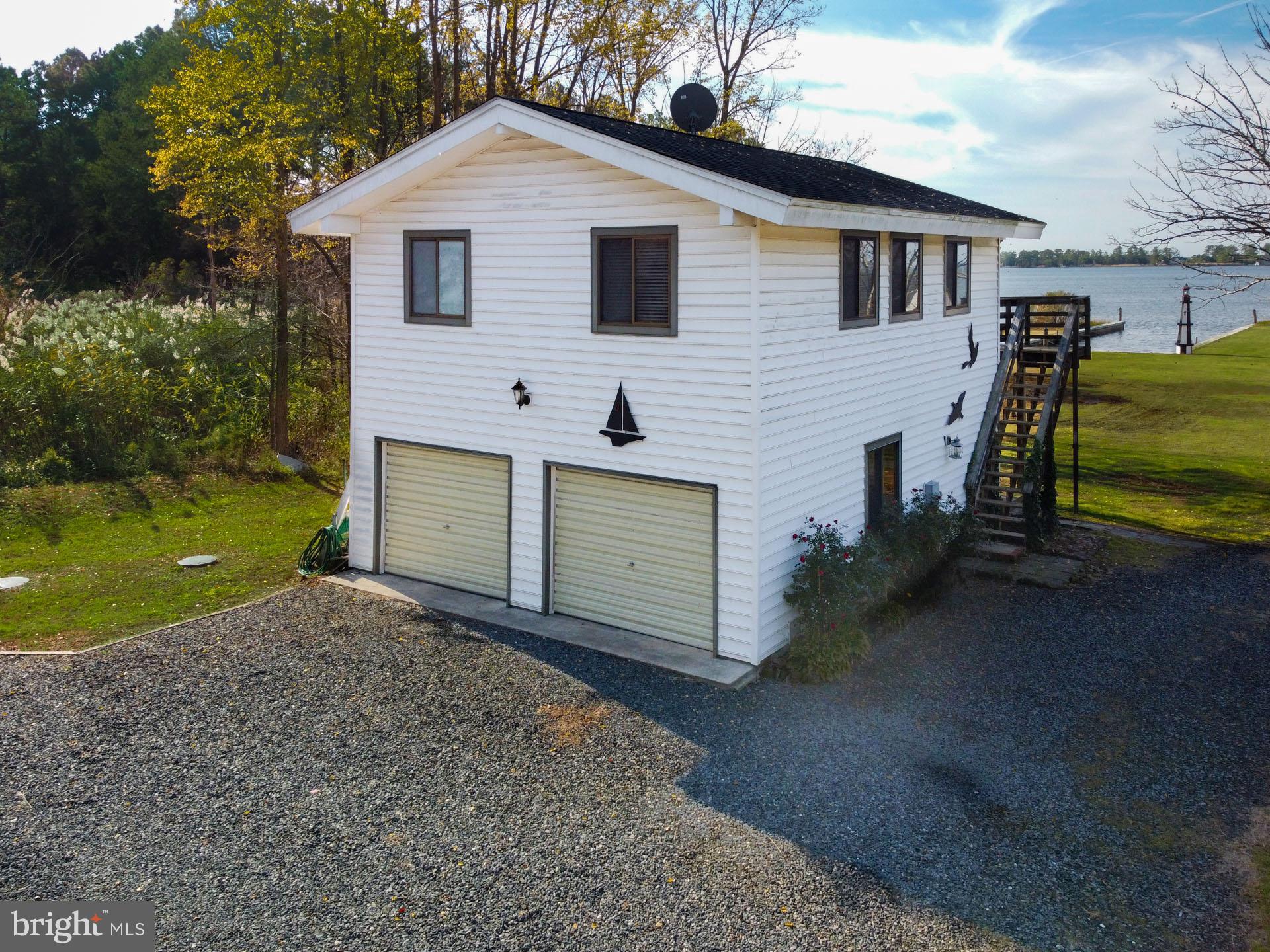 1308 Town Point Road Cambridge, MD 21613 - Photo 43 of 61 a view of a house with a yard