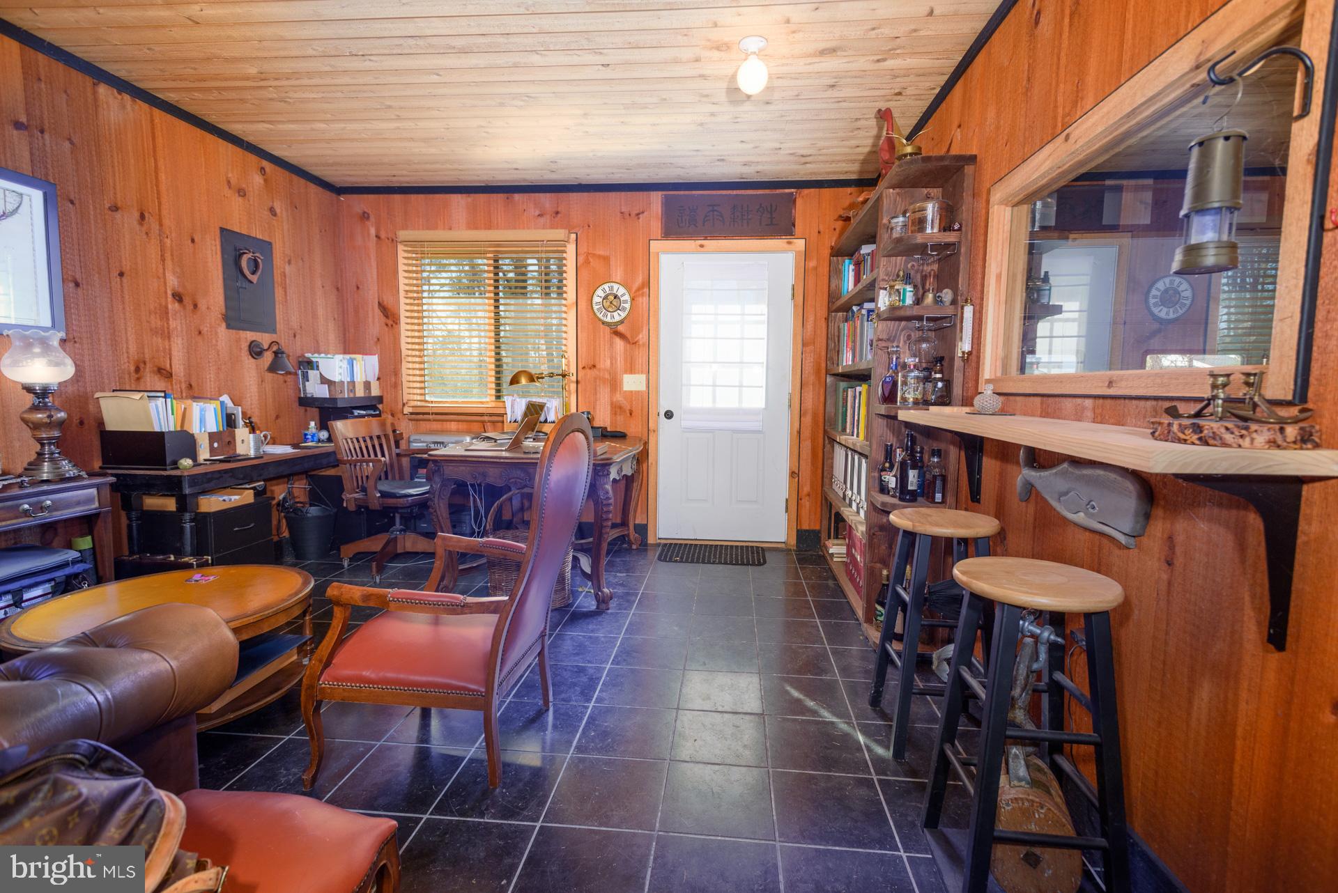 1308 Town Point Road Cambridge, MD 21613 - Photo 49 of 61 a view of a dining room with furniture window and wooden floor
