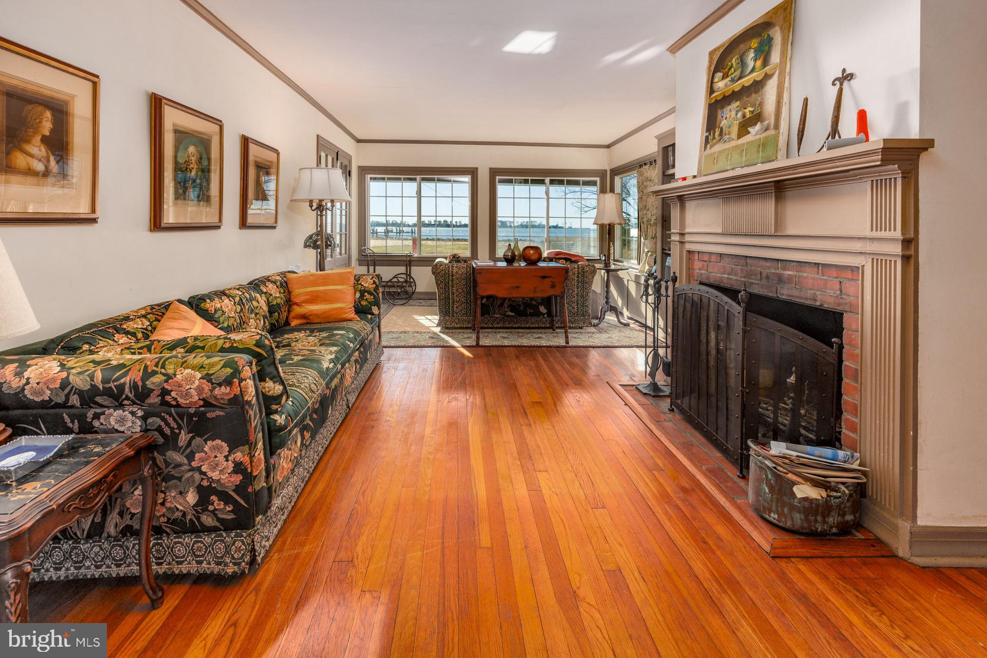 1308 Town Point Road Cambridge, MD 21613 - Photo 59 of 61 a living room with furniture and a fireplace