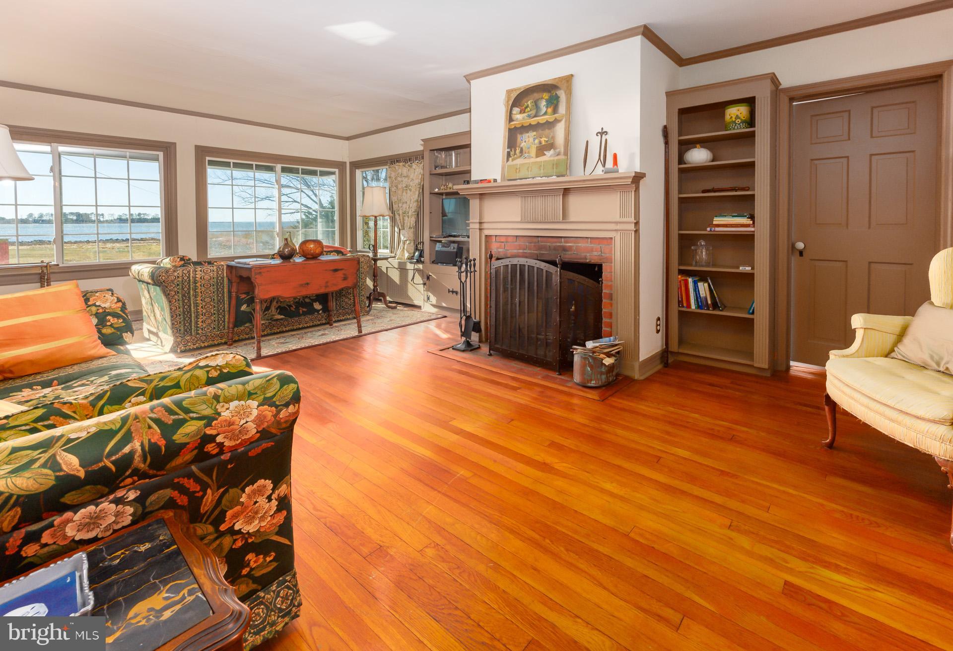 1308 Town Point Road Cambridge, MD 21613 - Photo 60 of 61 a living room with furniture and a fireplace