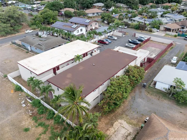 an aerial view of a house with a yard