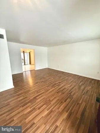 a view of a kitchen with furniture and a window