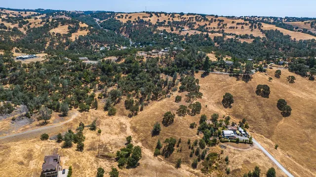 a view of a town with mountains in the background