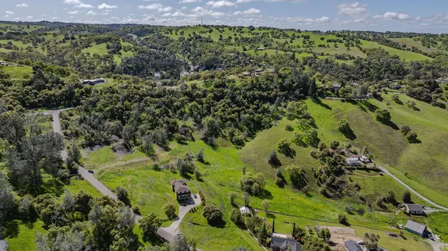 a view of a garden with a building