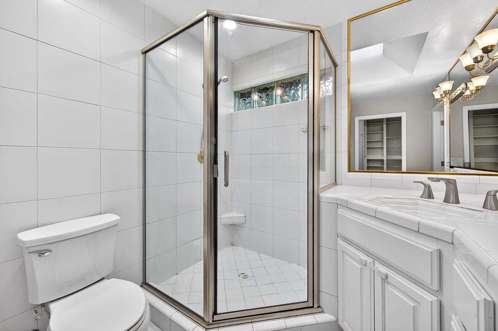 4337 Bannister Road Fair Oaks, CA 95628 - Photo 26 of 35 a bathroom with a shower a toilet and a sink