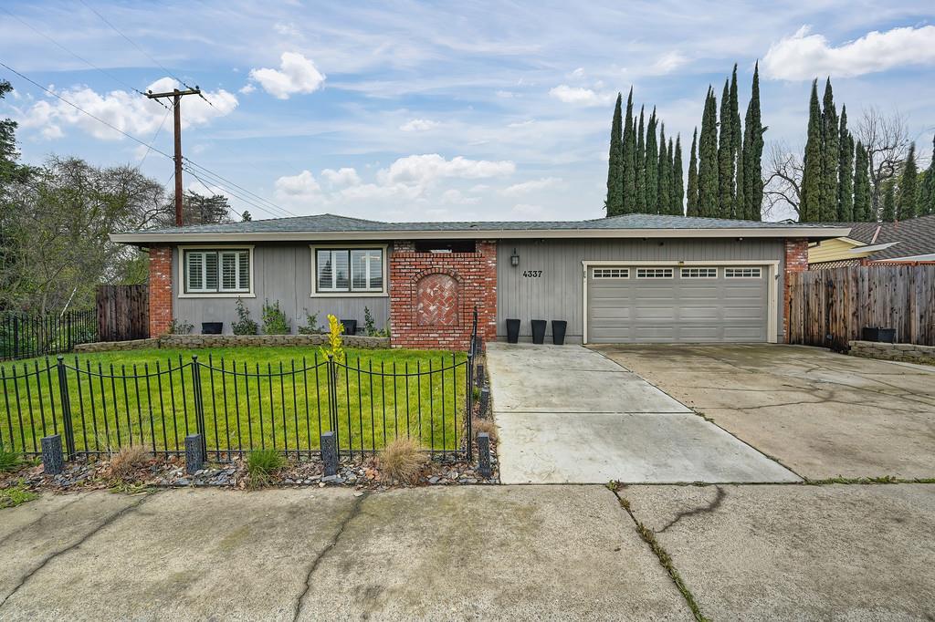 4337 Bannister Road Fair Oaks, CA 95628 - Photo 34 of 35 a front view of a house with garden