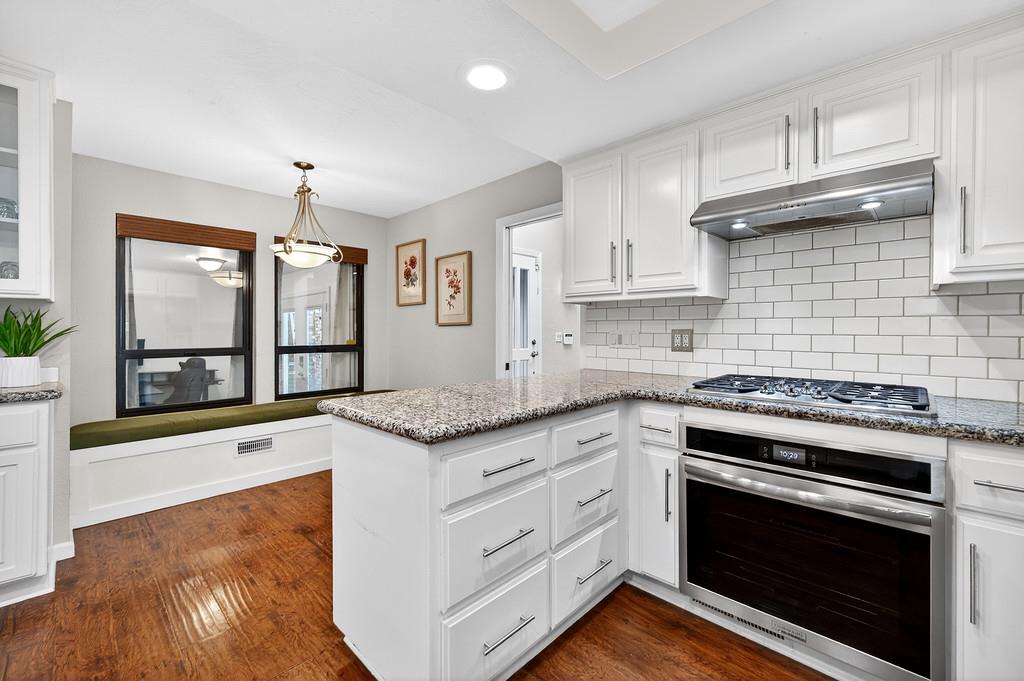 4337 Bannister Road Fair Oaks, CA 95628 - Photo 7 of 35 a kitchen with granite countertop a stove and a sink