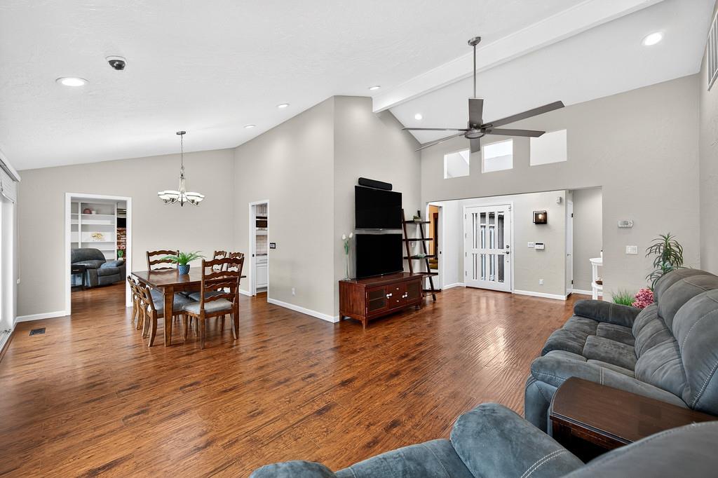 4337 Bannister Road Fair Oaks, CA 95628 - Photo 10 of 35 a living room with furniture a dining table and chairs with wooden floor
