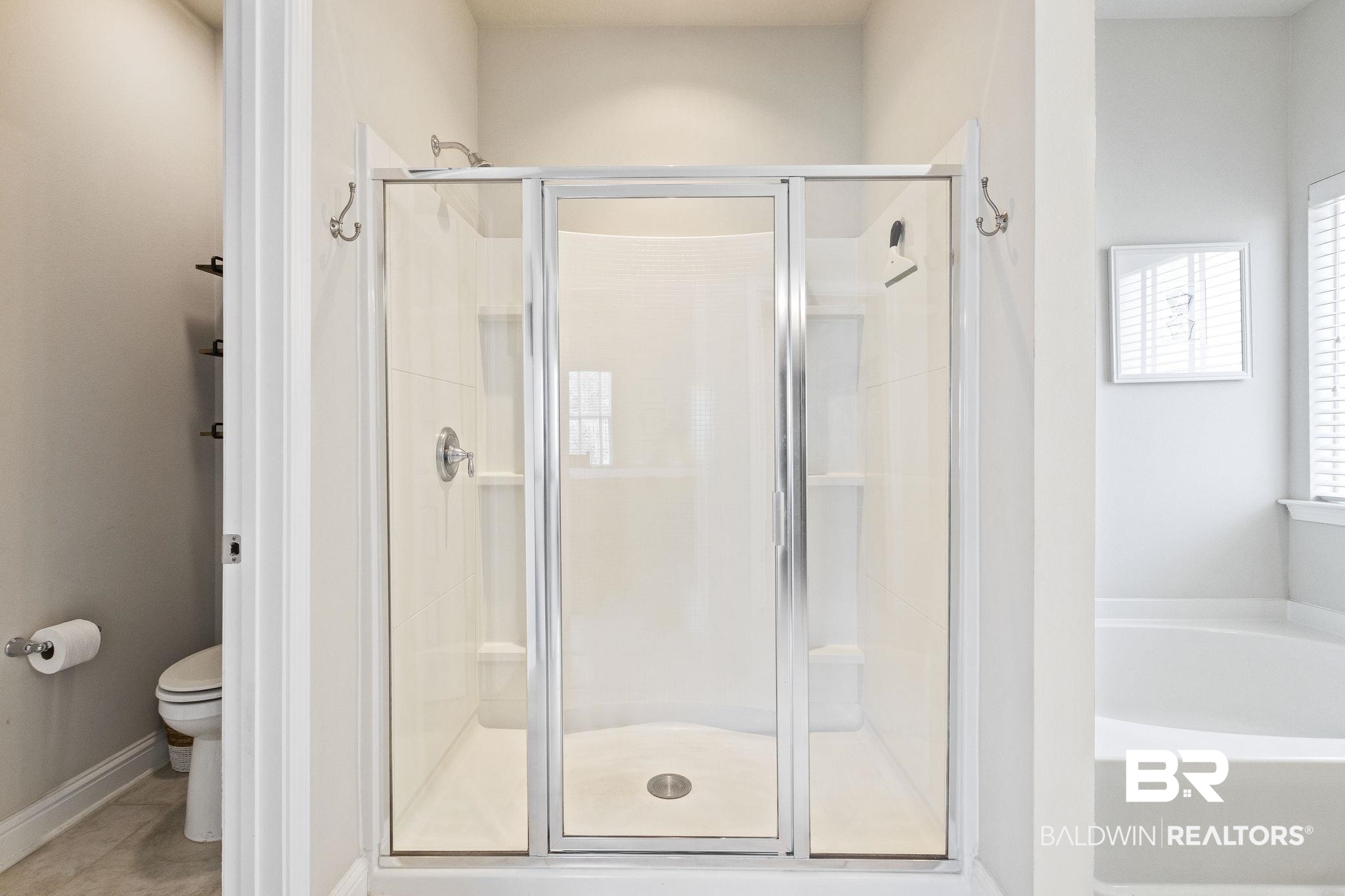 31663 Kestrel Loop Daphne, AL 36527 - Photo 39 of 86 Bathroom featuring plus walk in shower, tile patterned flooring, and toilet
