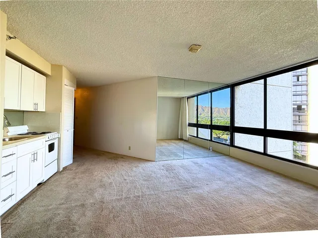 a view of an empty room with a window