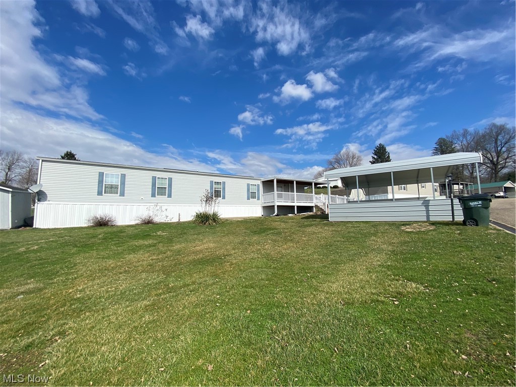 85 Rains Circle Zanesville, OH 43701 - Photo 1 of 15 Front of property featuring a lawn and a carport