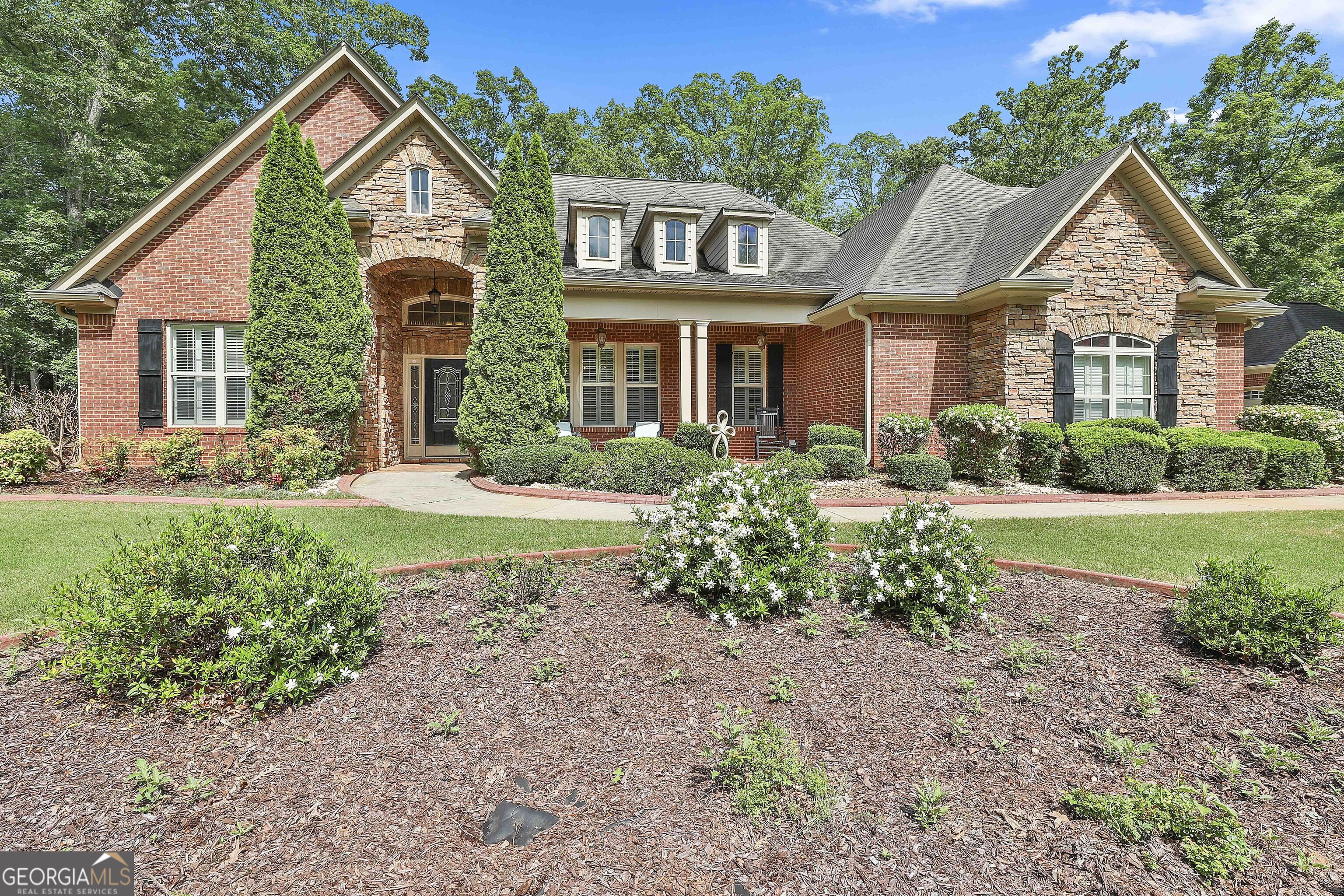 100 Emerson Ridge Trail Senoia, GA 30276 - Photo 1 of 1 a front view of a house with a yard