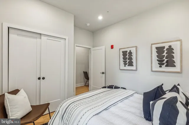 a bedroom with a bed and furniture