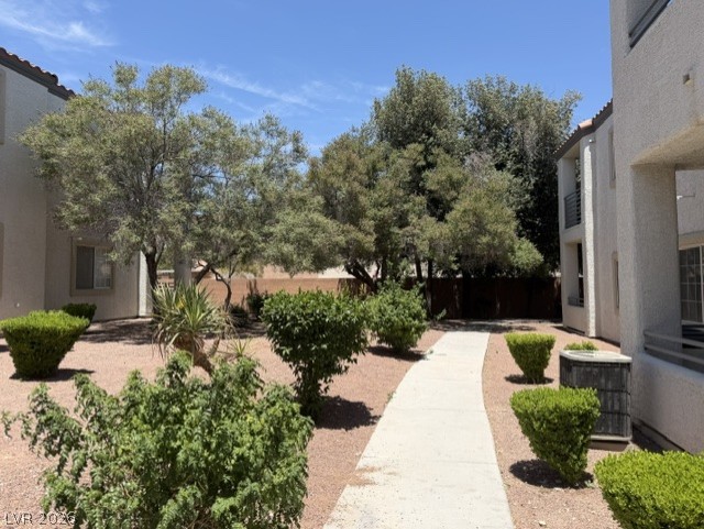 3318 North Decatur Boulevard, Unit 1163 Las Vegas, NV 89130 - Photo 1 of 35 A well-maintained walking path winds through this verdant courtyard, framed by mature trees and manicured shrubs.