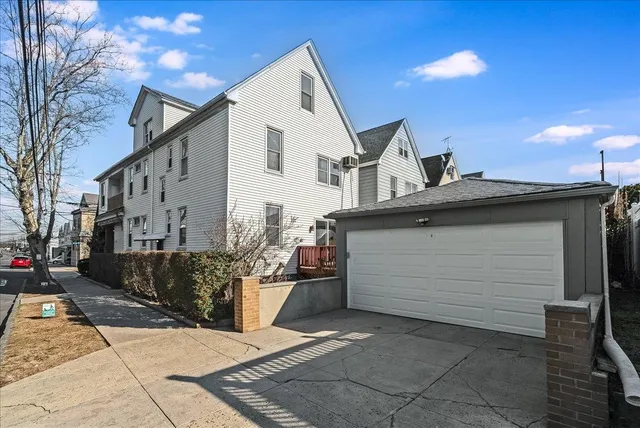 a view of a white house with a large windows