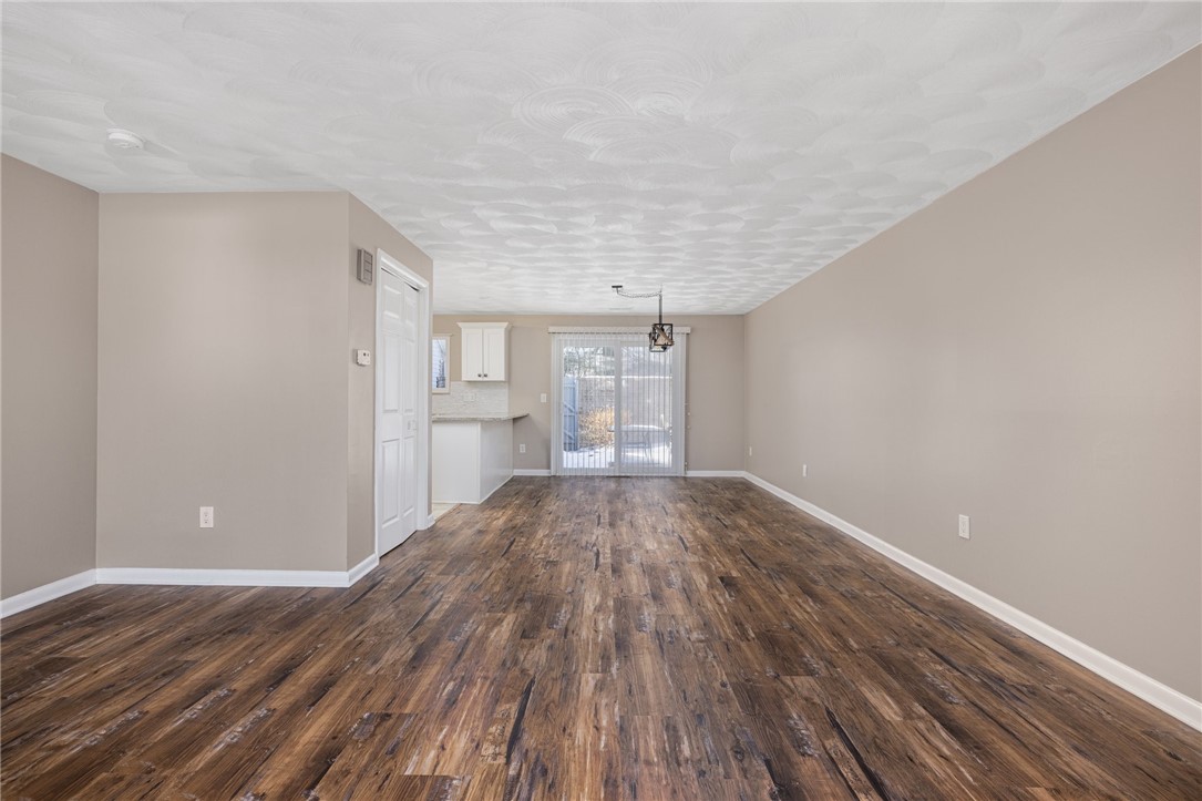 844 Williamsburg Circle, Unit 844 Warwick, RI 02886 - Photo 13 of 43 COMBINED LIVING ROOM AND DINING AREA