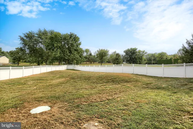 a view of a house with a wooden deck