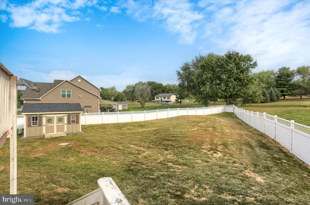 a view of front door of house with yard