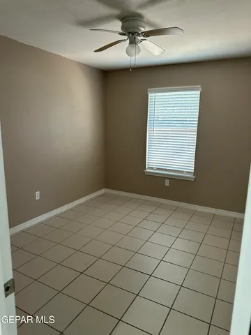 a view of an empty room and a window