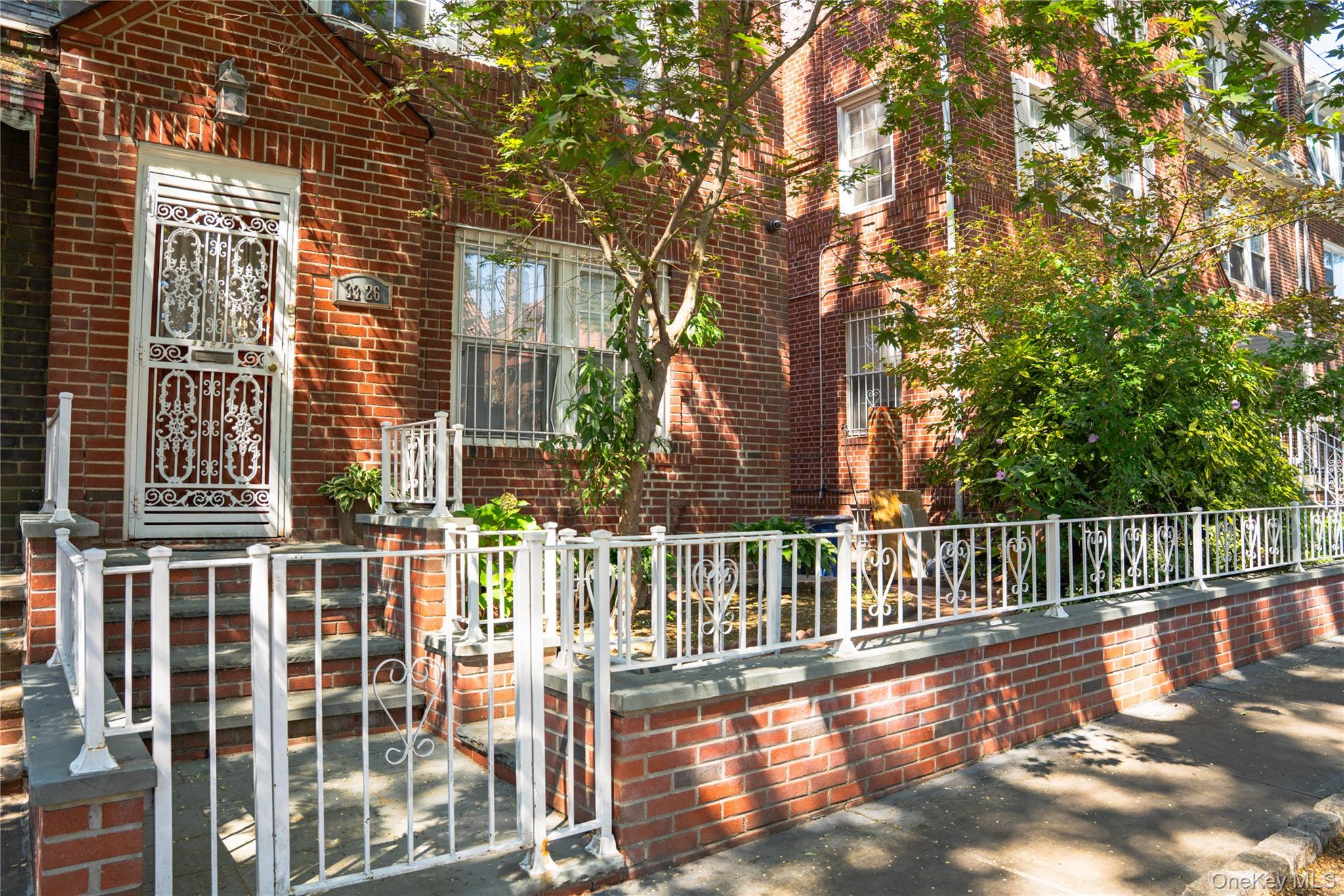 a view of a balcony with a floor to ceiling window and wooden fence