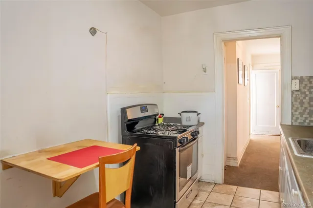 a kitchen with a sink and a stove
