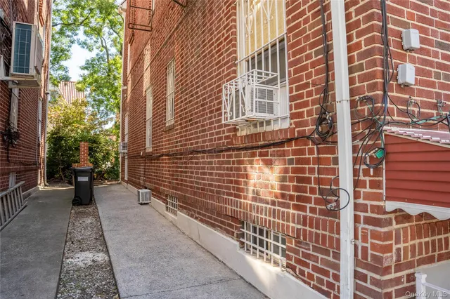 a view of a patio with a table and chairs and potted plants