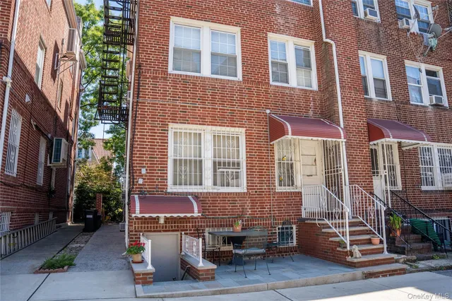 a front view of a brick building with many windows
