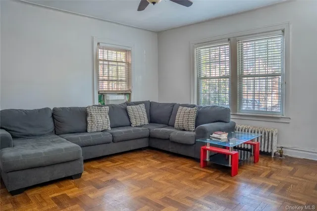 a living room with furniture and a window