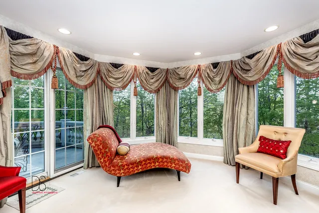 a view of a house with a yard patio and swimming pool