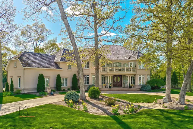 a front view of a building with a garden
