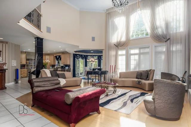 a view of an dining room with furniture large windows and wooden floor